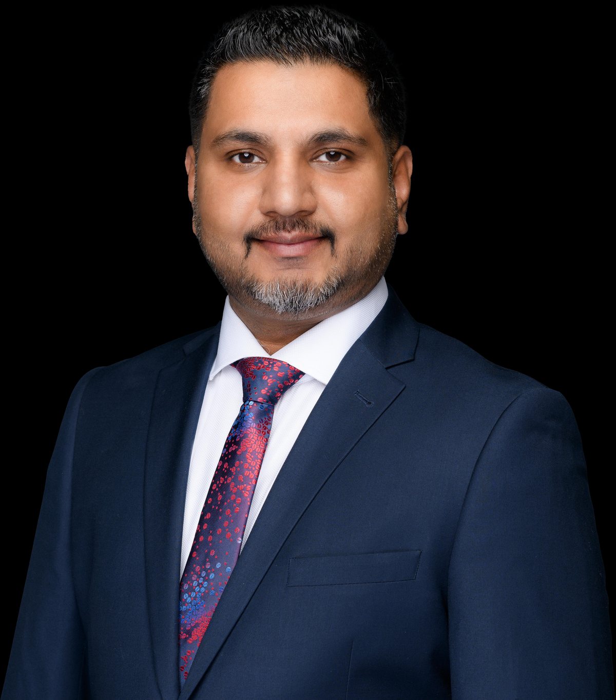 Gagan Rakhra, Allstate Sales Agent, in a navy suit